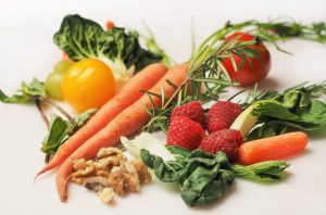 Carrots, tomatoes, kale nuts, strawberries