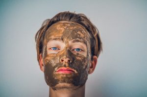 A person with a mud mask