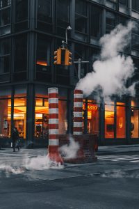 Fumes rising from the ground on a city street