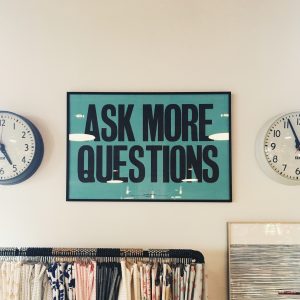 Sign stating Ask More Questions