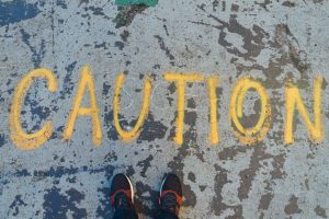 Caution spray painted on ground